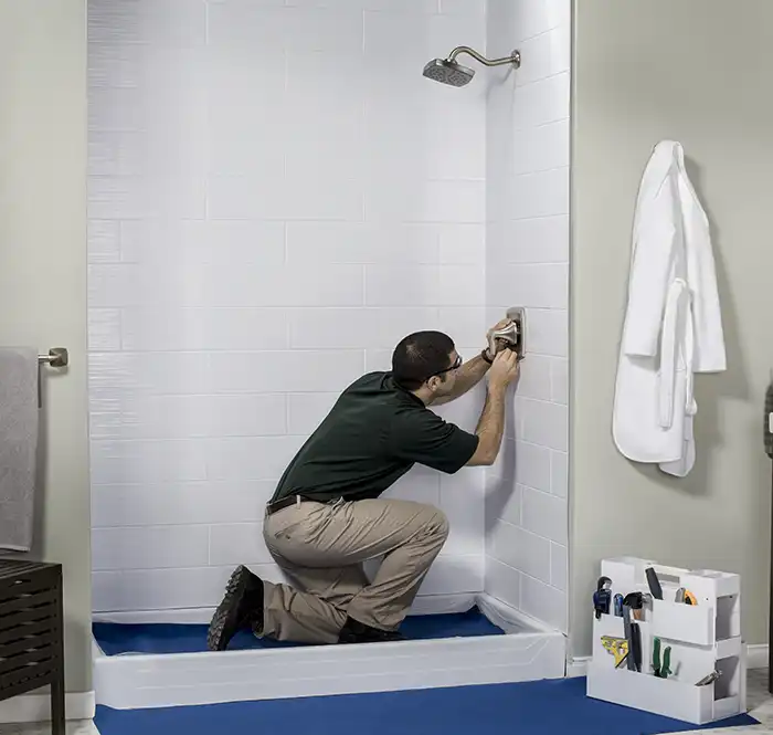 man installing shower